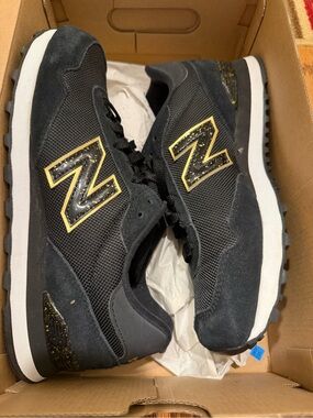 Gently worn woman’s black and gold 515 New Balance